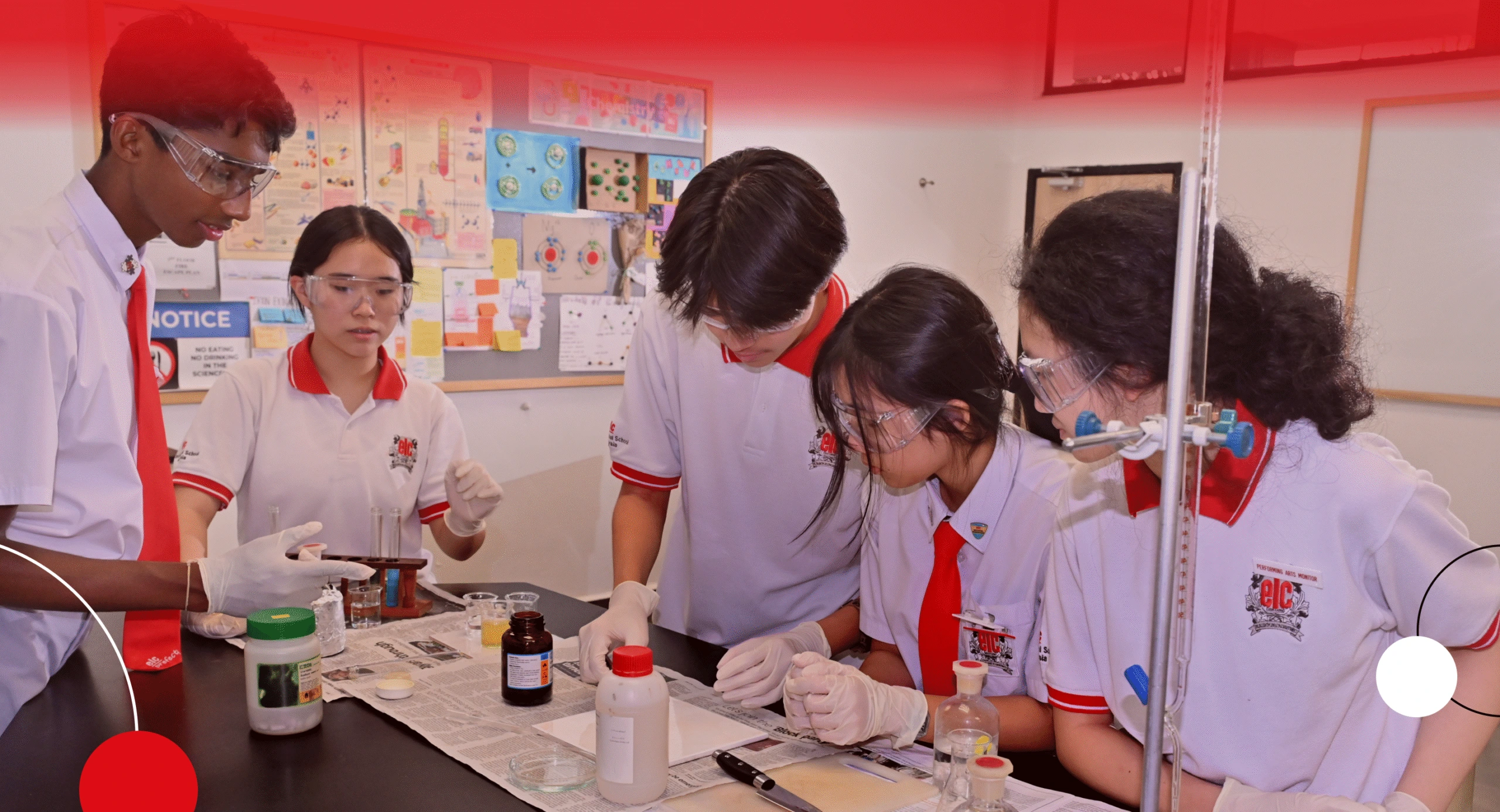 Teacher guiding students at ELC International School during a classroom science experiment, encouraging curiosity and teamwork.